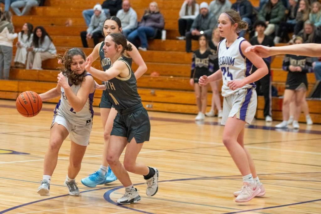 Sequim Gazette photo by Emily Matthiessen/ Manuela Valle Jover drives past North Kitsap defenders in Feb. 7 matchup.