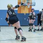 Sequim Gazette photo by Emily Matthiessen/ A member of Port Scandalous Roller Derby, Brittney Vincent, aka Sinnabunz, practices an offensive move at the Port Angeles Boys and Girls club
