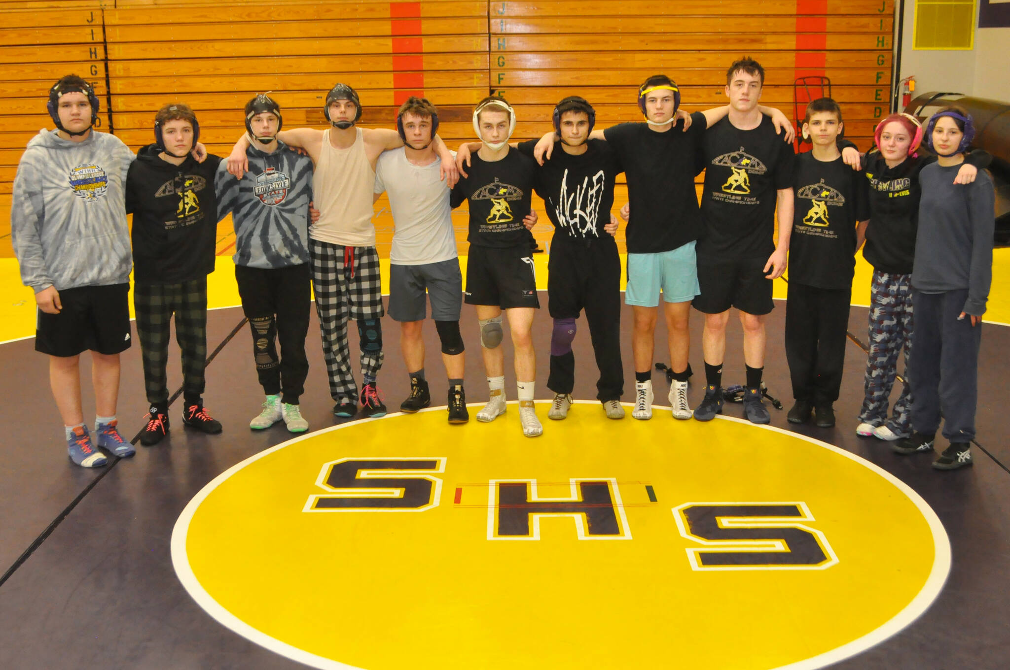 Sequim Gazette photo by Matthew Nash
Above: Sequim sent 12 wrestlers to the state 2A tournament on Feb. 21-22. They included, from left, Max Sivilli, Ryan Spelker, Johnny Vilona, Jayms Vilona, Jayms Vilona, James Mason, Riley Downs, Finn Jones, Aiden Glenn, Dylan Bowen, Brandon Bair, Bailey Stein and Story Snow. As a team, they recorded 13 wins and the boys tied for 33rd and the girls 52nd.