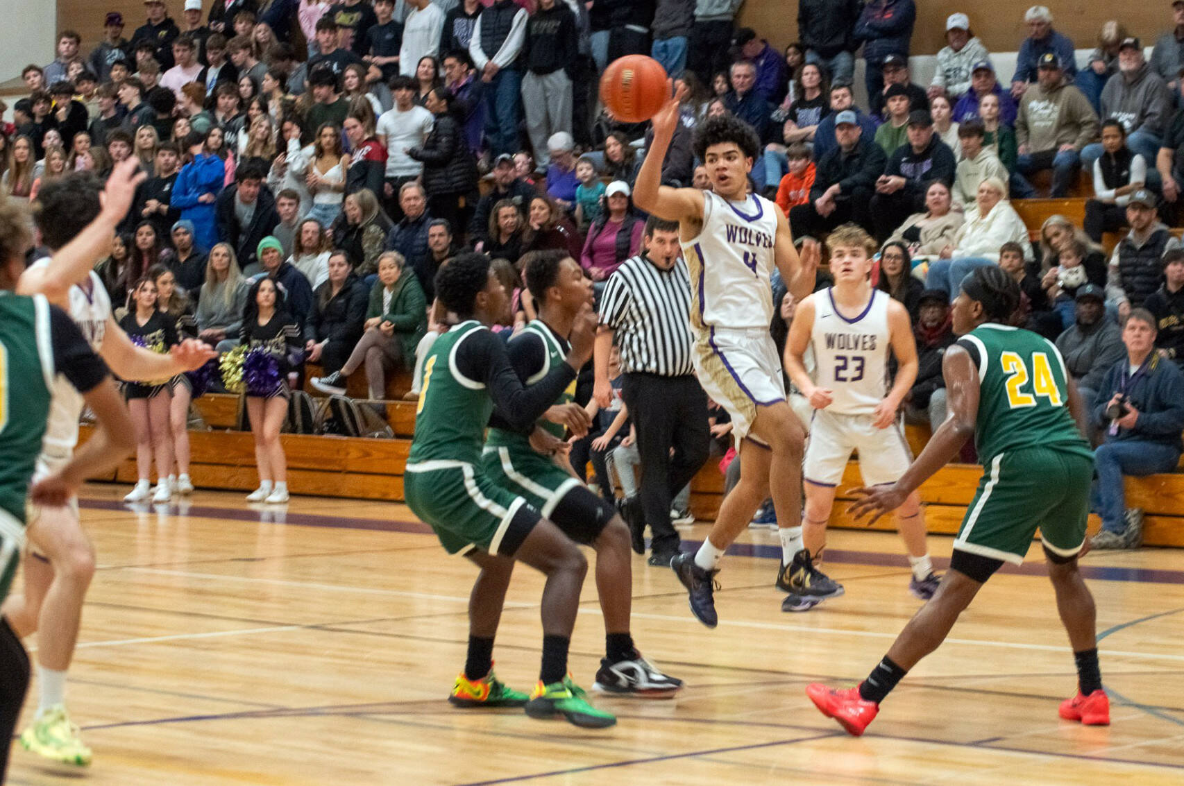 Sequim Gazette photo by Emily Matthiessen
Jericho Julmist looks to pass in a tournament game at home on Feb. 19 against Foss. He led the Wolves in the win with 37 points.