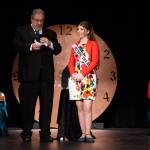 Sequim Gazette photo by Emily Matthiessen/ Master of Ceromonies Guy Horton reads a random question of royalty candidate Lily Tjemsland while candidate Joanna Morales listens with pageant decorum.