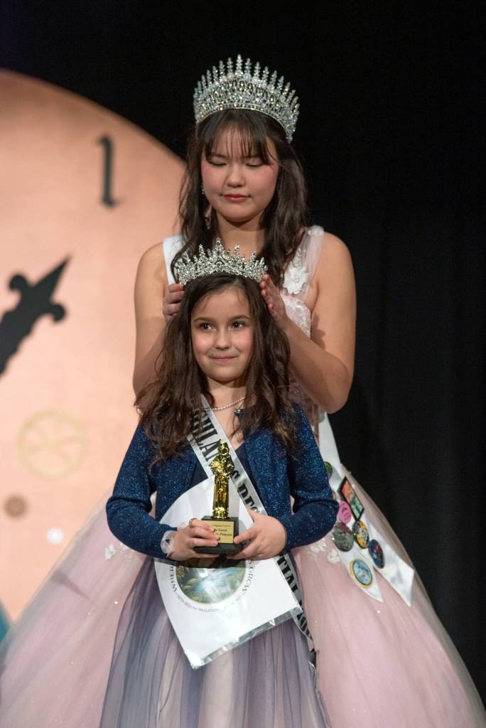 Sequim Gazette photo by Emily Matthiessen/ Sequim 129th Irrigation Festival princess Kailah Blake crowns Stella Good a junior royalty princess during the 130th Festivals pageant.