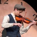 Sequim Gazette photo by Emily Matthiessen/ Sequim Irrigation Festivals scholarship pageant contestant Malachi Byrne plays Jay Ungers Ashokan Farewell onstage before a full audience at the high school auditorium.