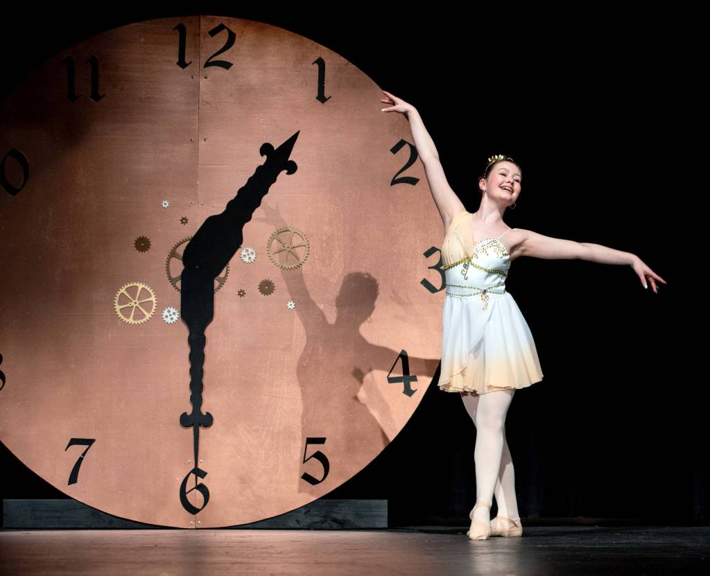 Sequim Gazette photo by Emily Matthiessen/ Sequim Irrigation Festival scholarship pageant contestant Roxy Woods performs Cupids Variation from the Don Quixote ballet onstage with the steampunk set, a clock pointing at 1:30 for the 130th year of the festival behind her.