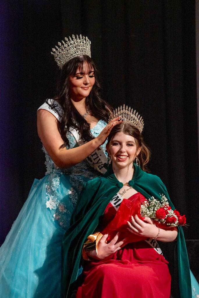 Sequim Gazette photo by Emily Matthiessen/ Outgoing Irrigation Festival queen Ariya Goettling crowns incoming Queen Lily Tjemsland at the scholarship pageant Saturday night.