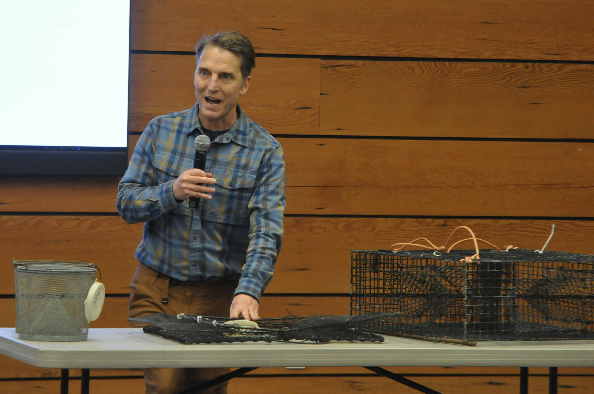 Sequim Gazette photo by Matthew Nash
Neil Harrington, environmental biologist for the Jamestown SKlallam Tribe, speaks to a crowd of about 30 people on Feb. 25 about efforts to trap European green crab in the Sequim/Dungeness area. This year, the tribe seeks more volunteers for its trapping efforts from April to September/October, to prevent the invasive species from killing native eelgrass, clams, oysters, and native crab species.