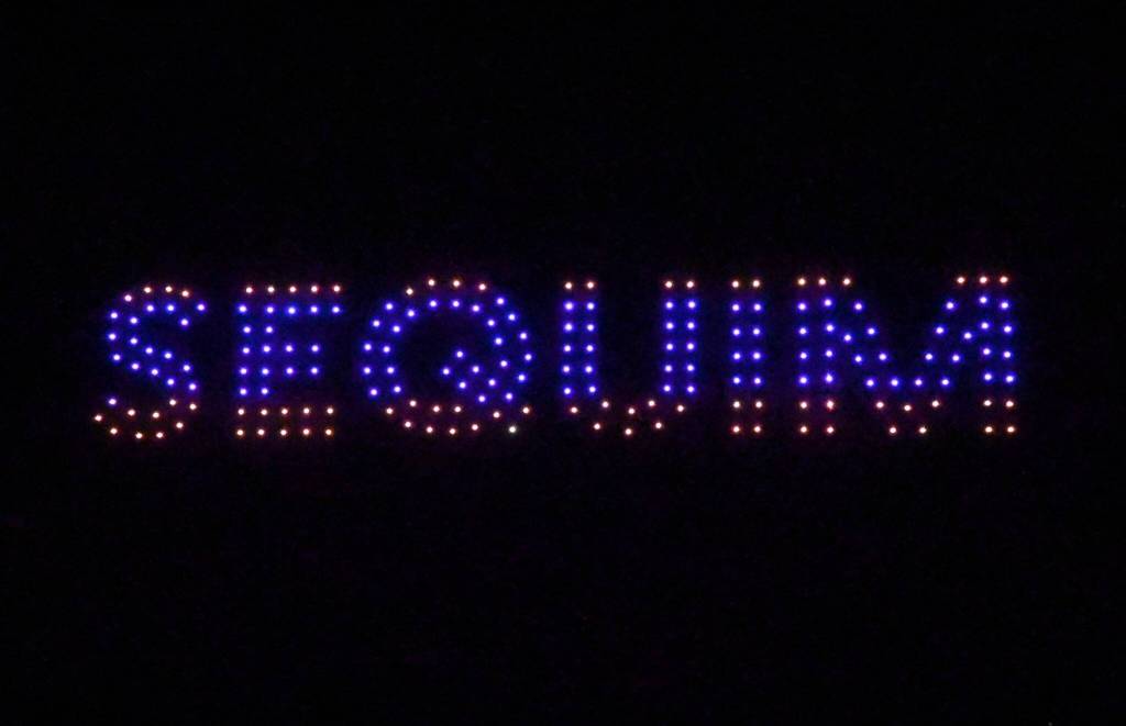 Sequim Gazette file photo by Michael Dashiell / Sequim Sunshine Festivals Illuminated Drone Show, seen here in 2024 spelling out Sequim with 300 drones, returns this weekend at 7 p.m. Saturday, March 8 in Carrie Blake Community Park.