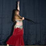 Sequim Gazette photo by Emily Matthiessen/ Sequim resident Laura Samperi-Ferdig dances with a sword at Studio Bob in Port Angeles on Feb. 21. Known as Talia in the belly dancing world, Samperi-Ferdig has studied the art since she was 8 and has taught since she was 16.