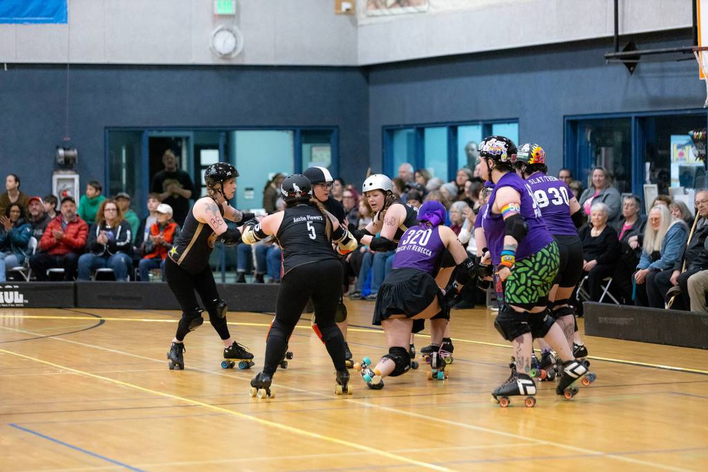 Courtesy of Angelina Morales Photography/ The Port Scandalous Scandals versus the Bellingham Roller Betties Tough Love fought a 103-201 point game in the Scandalss opening bout of the season on Feb. 22 at the Boys and Girls club in Sequim.