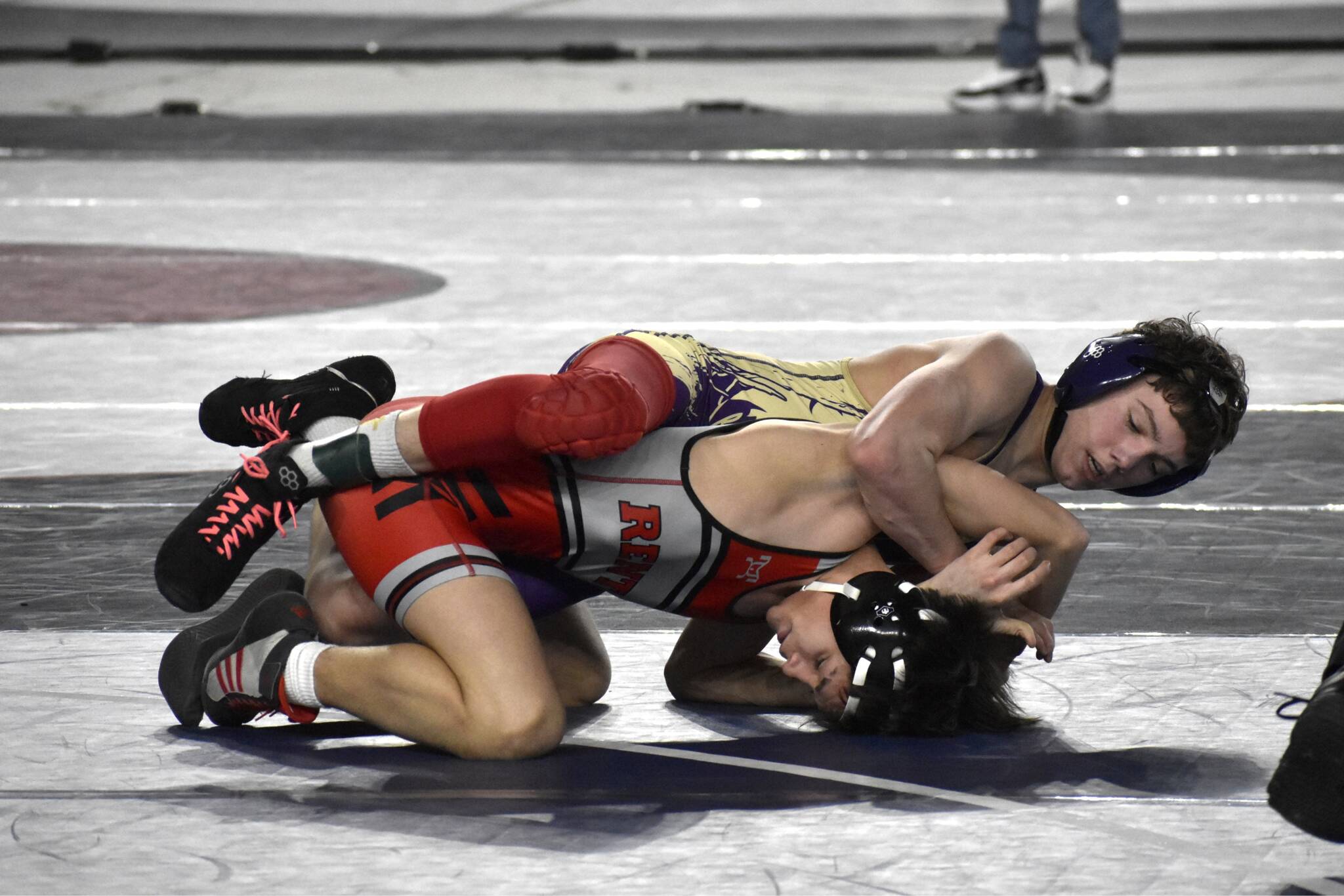 Photo courtesy Tyler Izatt
Ryan Spelker of Sequim works to pin Joseph Huynh on Renton in the first round of the 2A Mat Classic state tournament on Feb. 21 in the Tacoma Dome.