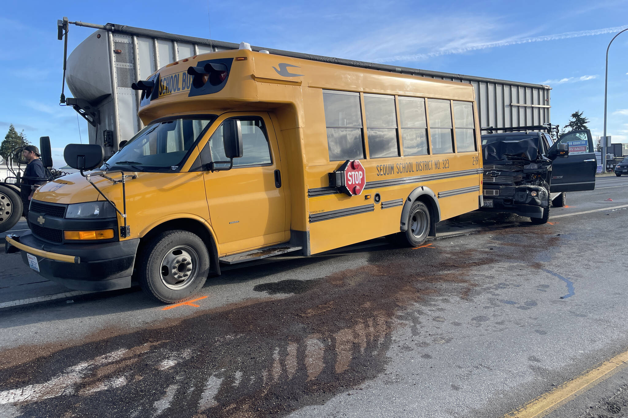 Photo courtesy Washington State Patrol/ A driver suspected of driving under in the influence struck a chip trailer and school bus on the morning of March 5 near Carlsborg Road. The bus driver was transported to Olympic Medical Center with minor injuries.