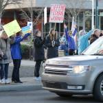 Sequim Gazette photo by Matthew Nash/ Locals gathered on March 4 to oppose federal cuts to local programs and staff, and proposed cuts to programs like Medicaid. Many also had signs in support of Ukraine in its fight against Russia.