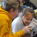At Right: Damien Enges and Alyx Smith share a laugh while reading an Arthur book at Greywolf Elementary for Read Across America Day in Sequim.