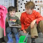 Sequim Gazette photo by Matthew Nash/ Kindergartener Keiran Bandy reads The Duckling gets a cookie? to eighth grader Bento Sellmeyer on March 7.