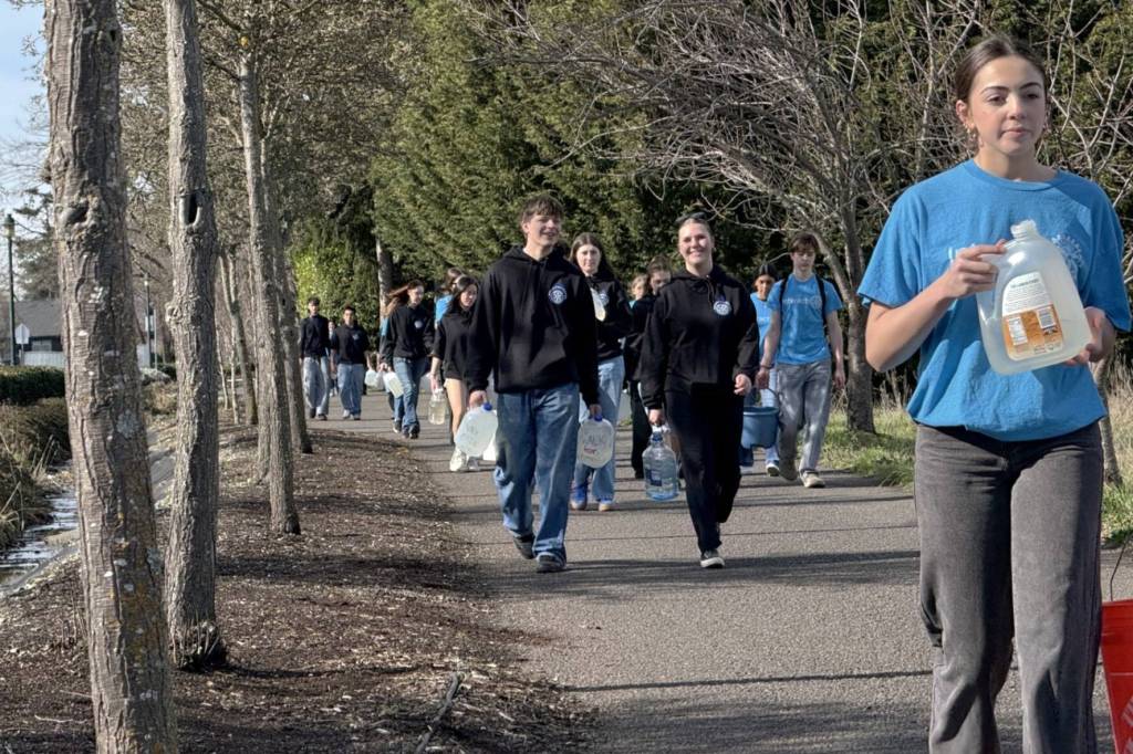 Photo by John Pehrson/ Sequim High schoolers walk along the Olympic Discovery Trail on March 1 for Walk for Water, a fundraiser for a well in a Ghana village.