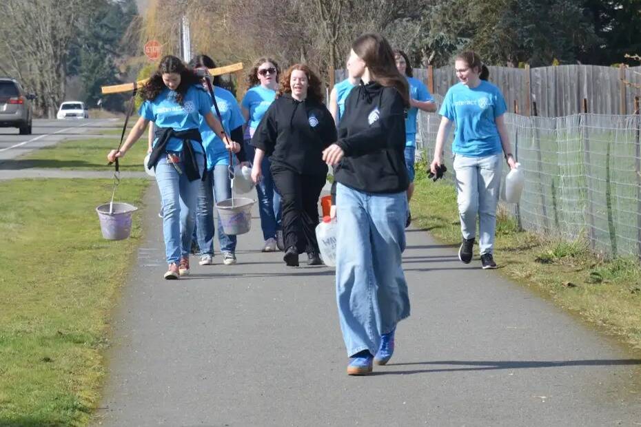 Photo by John Pehrson/ Sequim High schoolers walk along the Olympic Discovery Trail on March 1 for Walk for Water, a fundraiser for a well in a Ghana village.