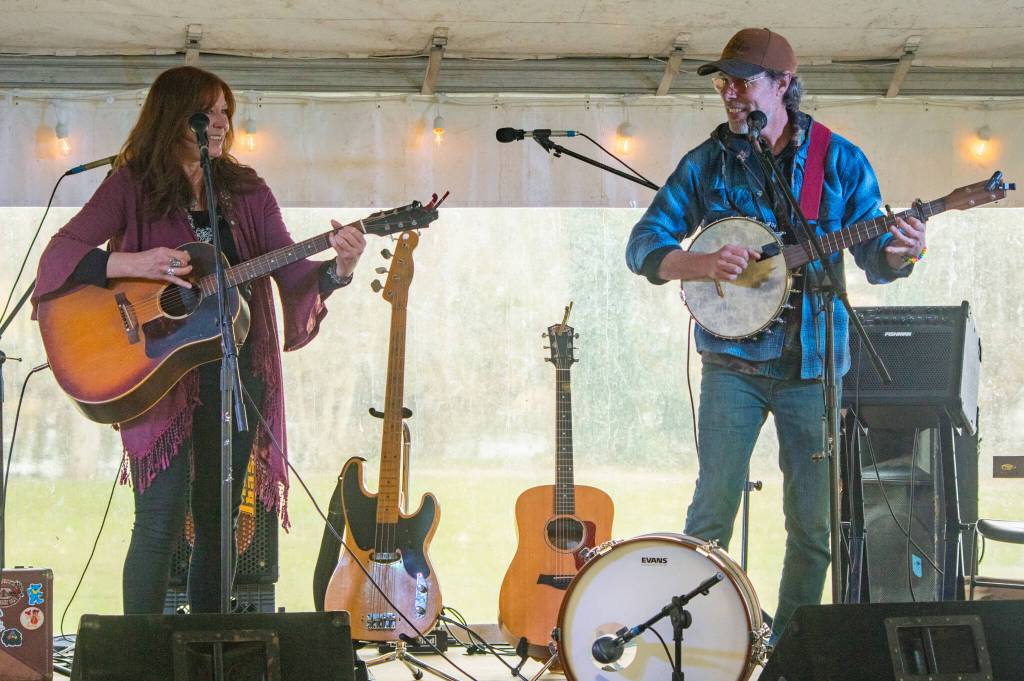 Sequim Gazette photo by Emily Matthiessen/ Kim Trenerry and Jason Mogi of Deadwood Revival perform in the Entertainment tent at the Sequim Sunshine Festival on Sat.