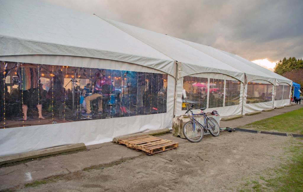 Sequim Gazette photo by Emily Matthiessen/ As is tradition, the sun played peekaboo with the clouds during Sequims Sunshine Festival, seen here outside the Entertainment Tent in Carrie Blake park.