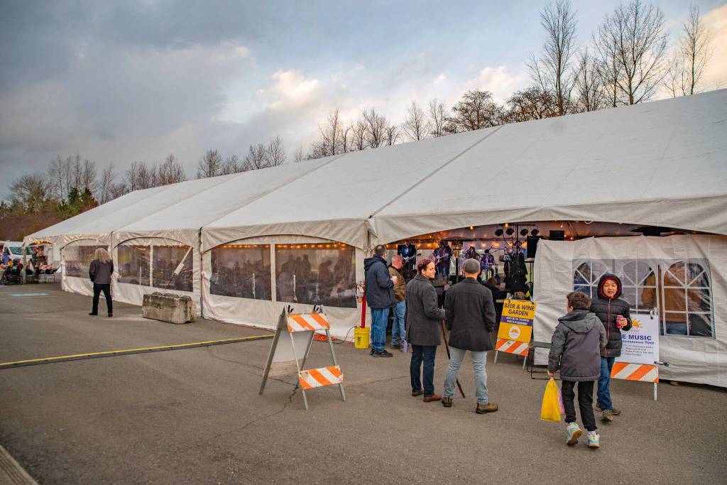 Sequim Gazette photo by Emily Matthiessen/ During the Sunshine Festival, outside the Entertainment Tent at Carrie Blake Park citizens enjoy the mild weather.