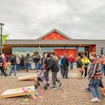 Sequim Gazette photo by Emily Matthiessen/ A few people play cornhole as the crowd begins to disperse following the Friday night opening ceremonies of the Sunshine Festival at the Sequim Civic Center.