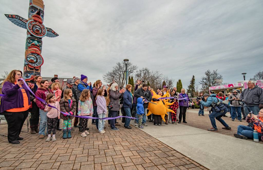 Sequim Gazette photo by Emily Matthiessen/
The ribbon is cut for Sequims 6th annual Sunshine Festival at the Sequim Civic Center plaza with help from the Sequim-Dungeness Valley Chamber of Commerce.