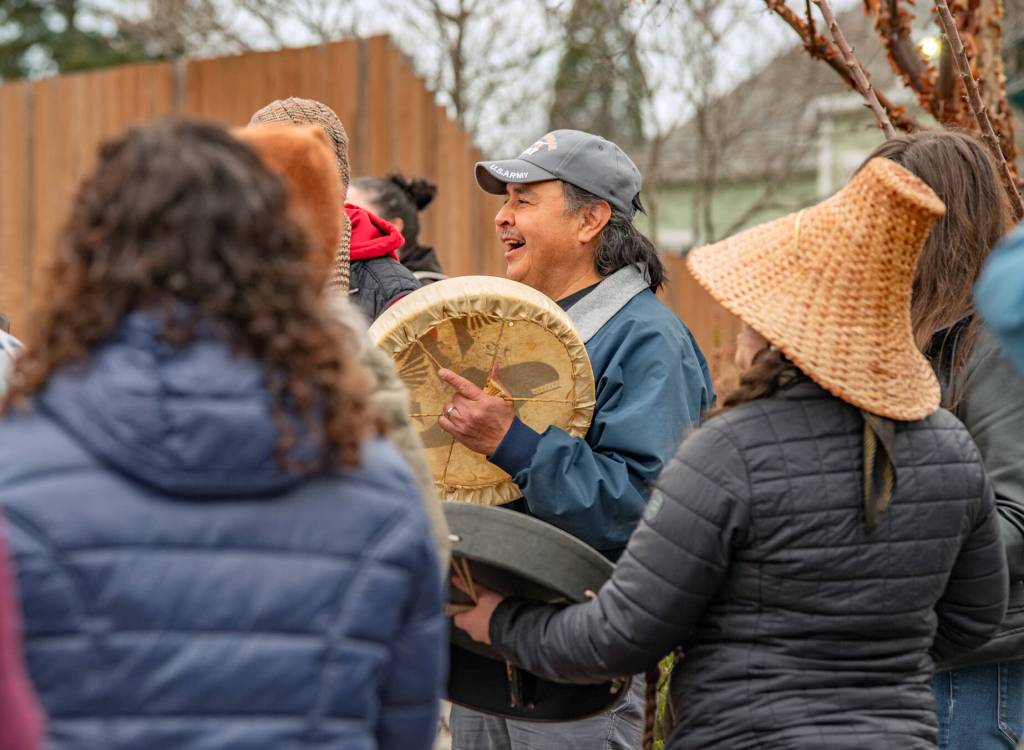Sequim Gazette photo by Emily Matthiessen/ Jamestown SKlallam tribe members beat drums at Sequims Sunshine festival opening ceremony at the civic center the moves of the Hooya Hooyay dance.