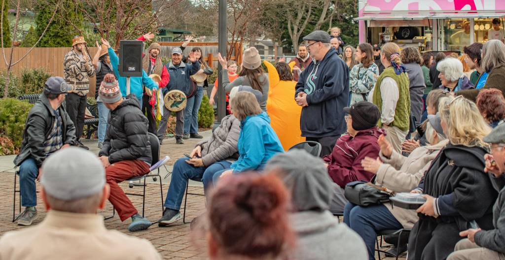 Sequim Gazette photo by Emily Matthiessen/ The crowd at the opening ceremonies for Sequims Sunshine Festival on Fri. evening applaud for Jamestown SKlallam musicians and dancers who are preparing to teach a celebratory dance.