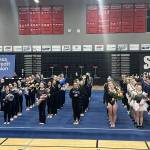 Photo courtesy Port Angeles/Sequim Gymnastics Team/ Sequims Lucy Spelker, front left, stands with fellow competitors at the 1A/2A/3A Gymnastics State Meet on Feb. 20.