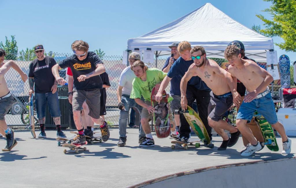 Sequim Gazette file photo by Emily Matthiessen/ Mark Simpson, top center with microphone, leads a race at the Sequim Skate Park in June 2022 as part of a benefit for the Sequim Youth Skate Park. He and others raised about $25,000 since 2016 towards an effort to remodel the park.