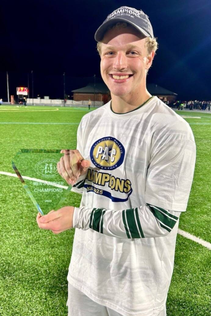 Photo courtesy Henninger Family
Aidan Henninger of Sequim celebrates Franciscan Universitys Presidents Athletic Conference championship last November where he scored the second goal in the 2-1 win to qualify for the NCAA Division III mens soccer championship bracket.