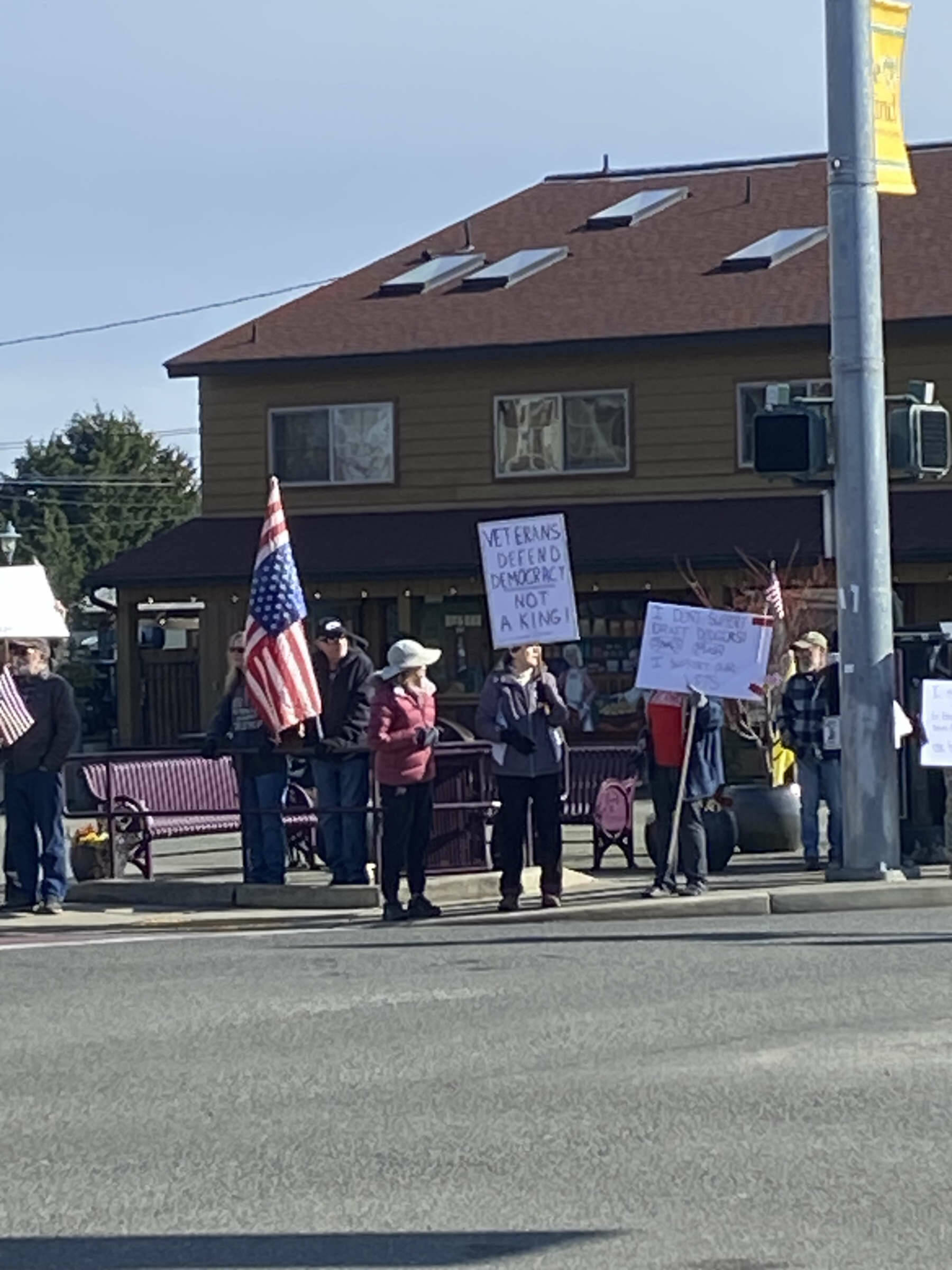 Photos by Lara Stanton
About 50 people, many holding signs, gathered at Sequim Avenue and Washington Street around lunchtime Friday to protest against President Donald Trump and his administration.