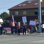 Photos by Lara Stanton
About 50 people, many holding signs, gathered at Sequim Avenue and Washington Street around lunchtime Friday to protest against President Donald Trump and his administration.