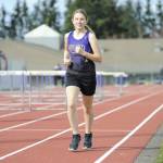 Sequim Gazette photo by Matthew Nash/ Sequims Violet Ollerman runs the 3200 meters on March 20 at Sequim School Districts track. It had been nearly four years since the district stopped hosting meets due to safety concerns. Sequims girls won the meet over six other teams.