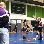 Photo courtesy of Petra Bernsten/ With coach Chad Cate watching, Petra Bernsten wins a match while on the Sequim High School wrestling team. Bernsten said Cate, who died during her first year at Washington State University, taught her a lot. Even to this day, I use things he has told me to get myself through a match, Bernsten said.