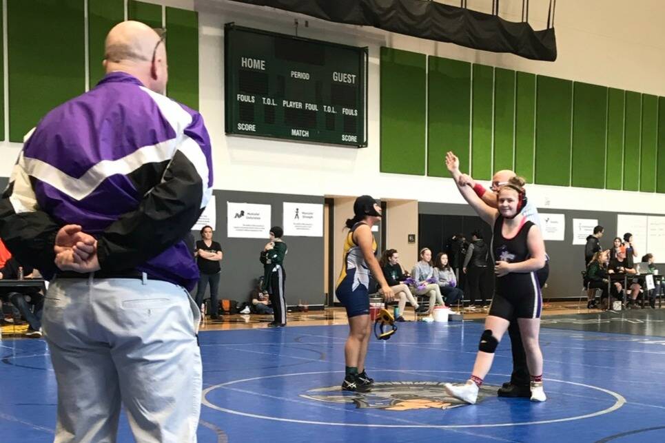 Photo courtesy of Petra Bernsten/ With coach Chad Cate watching, Petra Bernsten wins a match while on the Sequim High School wrestling team. Bernsten said Cate, who died during her first year at Washington State University, taught her a lot. Even to this day, I use things he has told me to get myself through a match, Bernsten said.