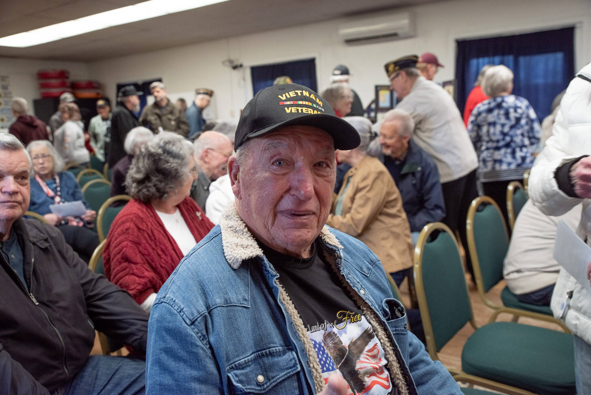 Sequim Gazette photo 
by Emily Matthiessen
Ed Hayko was among those who received a Vietnam veteran lapel pin during a packed-house ceremony honoring the service of Vietnam veterans at Sequims American Legion, Jack Grennan Post #62 on Saturday. The words A Grateful Nation Thanks and Honors You are embossed on the back of the pins, with an eagle set against the flag with a blue circle and laurel wreath and the words Vietnam War Veteran around it.