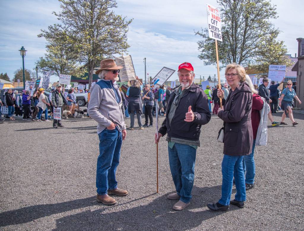 Sequim Gazette photo by Emily Matthiessen/ According to a clicker count by volunteers with Sequim Indivisible, 1298 people turned out by 11:45 a.m., with nearly 1400 people counted by 2:00 p.m. during Sequims version of the Hands Off  protests held across the nation and in other countries on Saturday. The protest was peaceful and orderly, according to police, organizers and protesters and featured a range of protest signs.