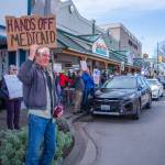 Sequim Gazette photo by Emily Matthiessen/ According to a clicker count by volunteers with Sequim Indivisible, 1298 people turned out by 11:45 a.m., with nearly 1400 people counted by 2:00 p.m. during Sequims version of the Hands Off  protests held across the nation and in other countries on Saturday. The protest was peaceful and orderly, according to police, organizers and protesters and featured a range of protest signs.