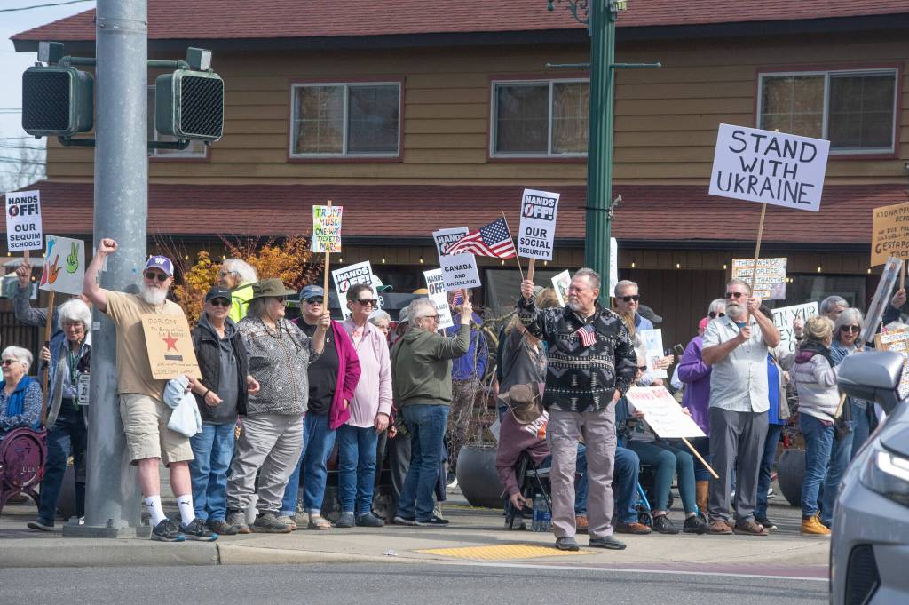 Sequim Gazette photo by Emily Matthiessen/ According to a clicker count by volunteers with Sequim Indivisible, 1298 people turned out by 11:45 a.m., with nearly 1400 people counted by 2:00 p.m. during Sequims version of the Hands Off  protests held across the nation and in other countries on Saturday. The protest was peaceful and orderly, according to police, organizers and protesters and featured a range of protest signs.