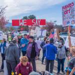 Sequim Gazette photo by Emily Matthiessen/ According to a clicker count by volunteers with Sequim Indivisible, 1298 people turned out by 11:45 a.m., with nearly 1400 people counted by 2:00 p.m. during Sequims version of the Hands Off  protests held across the nation and in other countries on Saturday. The protest was peaceful and orderly, according to police, organizers and protesters and featured a range of protest signs.