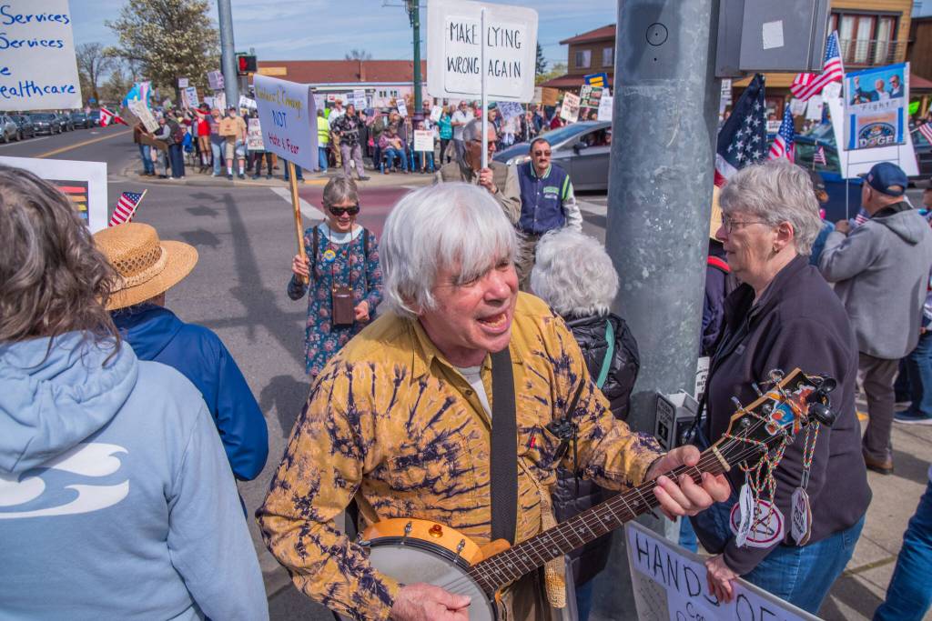 Sequim Gazette photo by Emily Matthiessen/ According to a clicker count by volunteers with Sequim Indivisible, 1298 people turned out by 11:45 a.m., with nearly 1400 people counted by 2:00 p.m. during Sequims version of the Hands Off  protests held across the nation and in other countries on Saturday. The protest was peaceful and orderly, according to police, organizers and protesters and featured a range of protest signs.