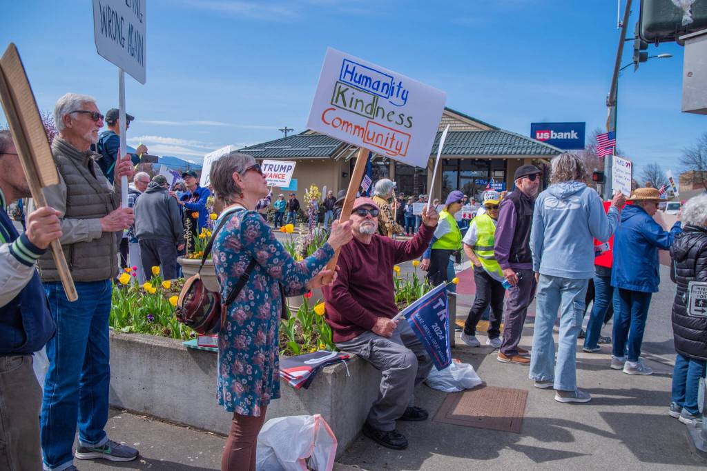 Sequim Gazette photo by Emily Matthiessen/ According to a clicker count by volunteers with Sequim Indivisible, 1298 people turned out by 11:45 a.m., with nearly 1400 people counted by 2:00 p.m. during Sequim's version of the "Hands Off " protests held across the nation and in other countries on Saturday. The protest was peaceful and orderly, according to police, organizers and protesters and featured a range of protest signs.