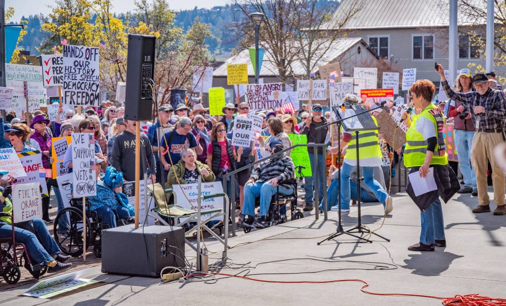 Sequim Gazette photo by Emily Matthiessen/ According to a clicker count by volunteers with Sequim Indivisible, 1298 people turned out by 11:45 a.m., with nearly 1400 people counted by 2:00 p.m. during Sequims version of the Hands Off  protests held across the nation and in other countries on Saturday. The protest was peaceful and orderly, according to police, organizers and protesters and featured a range of protest signs.
