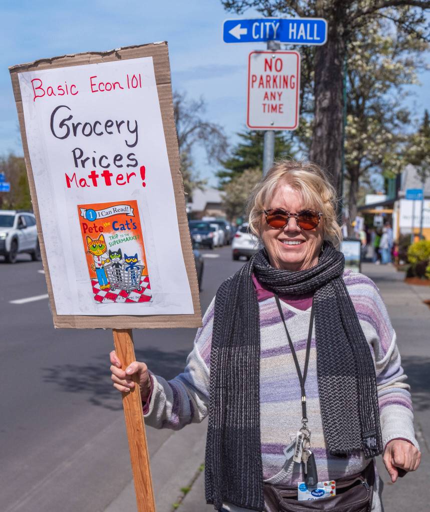 Sequim Gazette photo by Emily Matthiessen/ According to a clicker count by volunteers with Sequim Indivisible, 1298 people turned out by 11:45 a.m., with nearly 1400 people counted by 2:00 p.m. during Sequim's version of the "Hands Off " protests held across the nation and in other countries on Saturday. The protest was peaceful and orderly, according to police, organizers and protesters and featured a range of protest signs.
