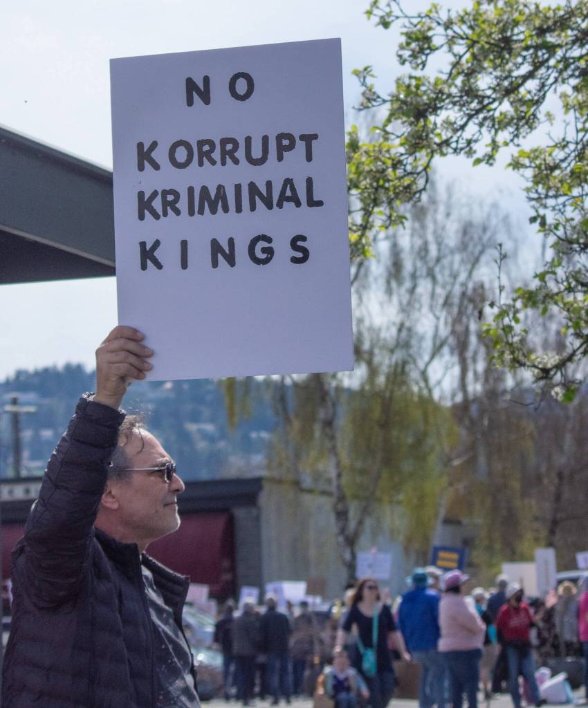 Sequim Gazette photo by Emily Matthiessen/ According to a clicker count by volunteers with Sequim Indivisible, 1298 people turned out by 11:45 a.m., with nearly 1400 people counted by 2:00 p.m. during Sequim's version of the "Hands Off " protests held across the nation and in other countries on Saturday. The protest was peaceful and orderly, according to police, organizers and protesters and featured a range of protest signs.
