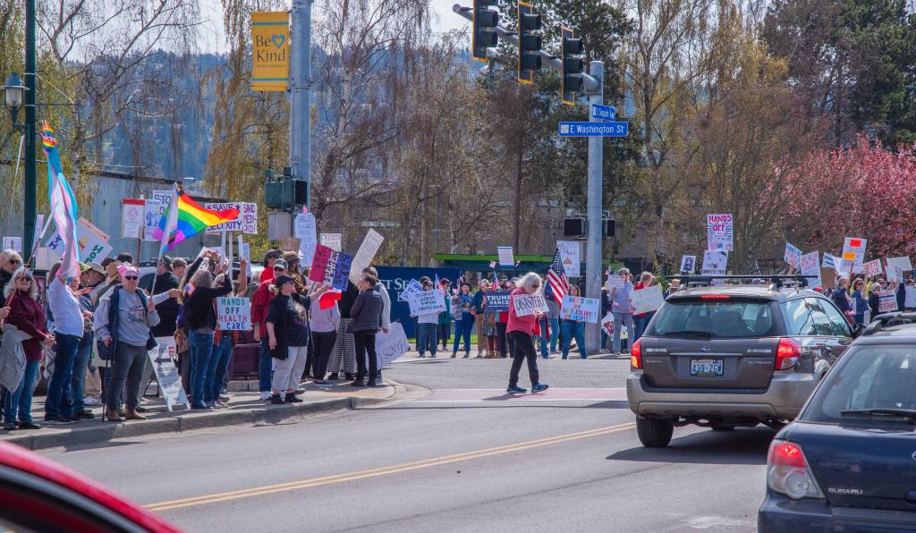 Sequim Gazette photo by Emily Matthiessen/ According to a clicker count by volunteers with Sequim Indivisible, 1298 people turned out by 11:45 a.m., with nearly 1400 people counted by 2:00 p.m. during Sequim's version of the "Hands Off " protests held across the nation and in other countries on Saturday. The protest was peaceful and orderly, according to police, organizers and protesters and featured a range of protest signs.