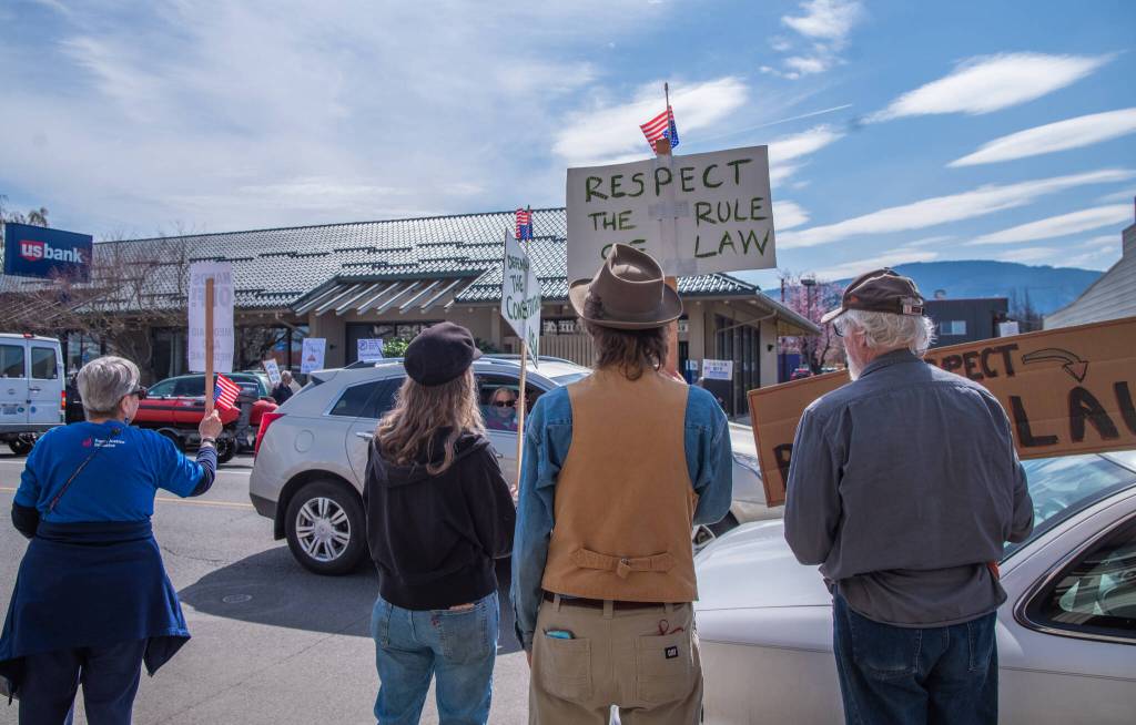 Sequim Gazette photo by Emily Matthiessen/ According to a clicker count by volunteers with Sequim Indivisible, 1298 people turned out by 11:45 a.m., with nearly 1400 people counted by 2:00 p.m. during Sequim's version of the "Hands Off " protests held across the nation and in other countries on Saturday. The protest was peaceful and orderly, according to police, organizers and protesters and featured a range of protest signs.