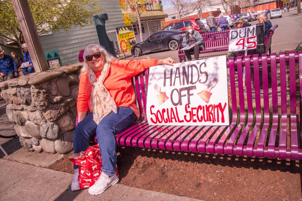 Sequim Gazette photo by Emily Matthiessen/ According to a clicker count by volunteers with Sequim Indivisible, 1298 people turned out by 11:45 a.m., with nearly 1400 people counted by 2:00 p.m. during Sequim's version of the "Hands Off " protests held across the nation and in other countries on Saturday. The protest was peaceful and orderly, according to police, organizers and protesters and featured a range of protest signs.
