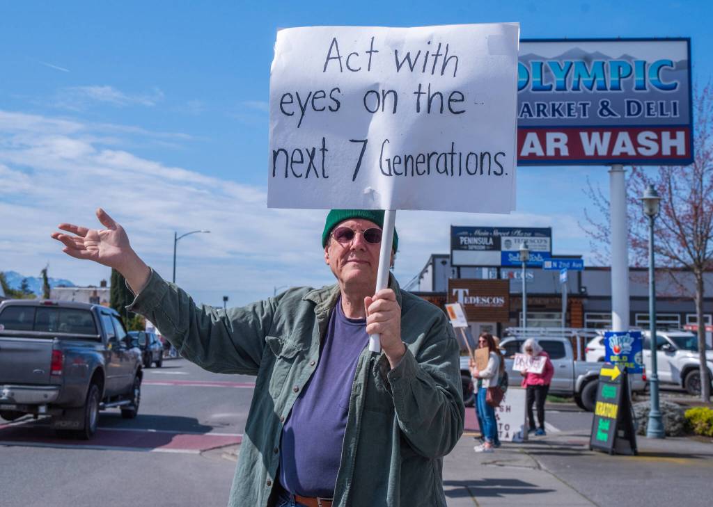 Sequim Gazette photo by Emily Matthiessen/ According to a clicker count by volunteers with Sequim Indivisible, 1298 people turned out by 11:45 a.m., with nearly 1400 people counted by 2:00 p.m. during Sequim's version of the "Hands Off " protests held across the nation and in other countries on Saturday. The protest was peaceful and orderly, according to police, organizers and protesters and featured a range of protest signs.