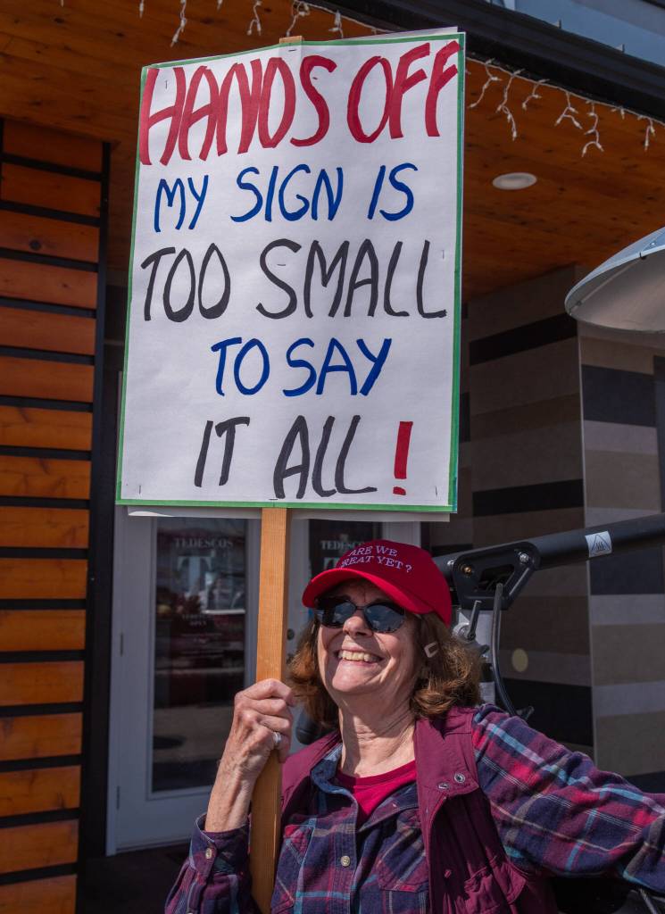 Sequim Gazette photo by Emily Matthiessen/ According to a clicker count by volunteers with Sequim Indivisible, 1298 people turned out by 11:45 a.m., with nearly 1400 people counted by 2:00 p.m. during Sequim's version of the "Hands Off " protests held across the nation and in other countries on Saturday. The protest was peaceful and orderly, according to police, organizers and protesters and featured a range of protest signs.